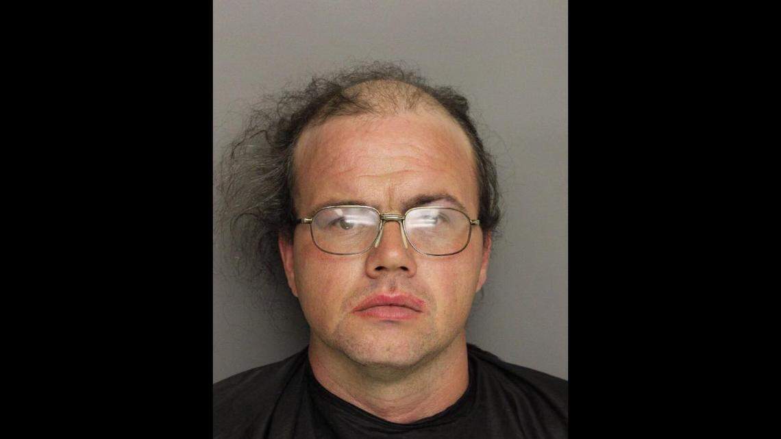 Shawn Thomas Hallett was arrested in a wig and dress, say Greenville Police.