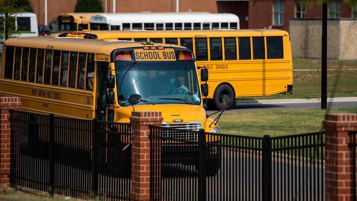 Buses arrive to load students at the end of the school day at Sun Valley High School on Monday, September 13, 2021 in Monroe, NC. In an effort to ease the workload of school nurses and staff and get healthy children back into the classroom, the Union County’s school board shocked many parents and voted Monday to immediately stop COVID-19 contact tracing and significantly curtail coronavirus quarantine requirements. Against advice of Union County’s health department as well as state and federal recommendations on reducing COVID-19 risks in classrooms, the school district will not require quarantine for students even if they’ve been in contact with someone who is sick. Union County Public Schools, under this change, says students must stay home only if they have tested positive or have clear COVID-19 symptoms.