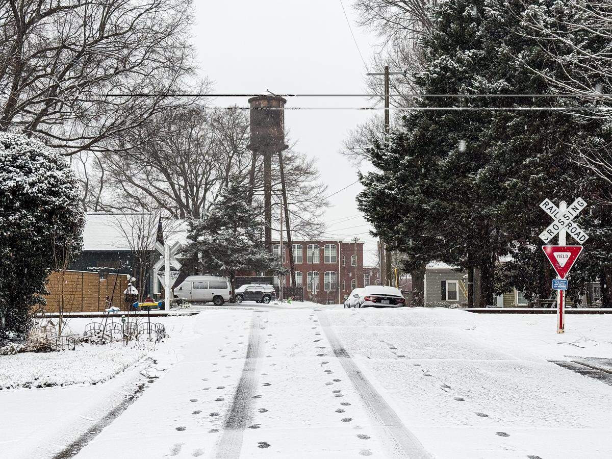 Snow begins to cover the NoDa neighborhood in Charlotte on Saturday, January 31.