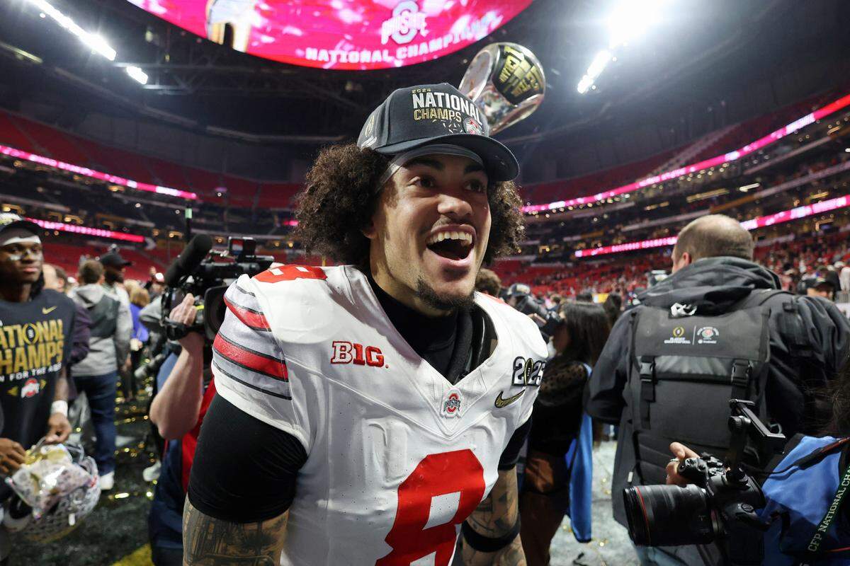 Ohio State Buckeyes safety Lathan Ransom (8) celebrates after winning against the Notre Dame Fighting Irish in the CFP National Championship college football game at Mercedes-Benz Stadium.