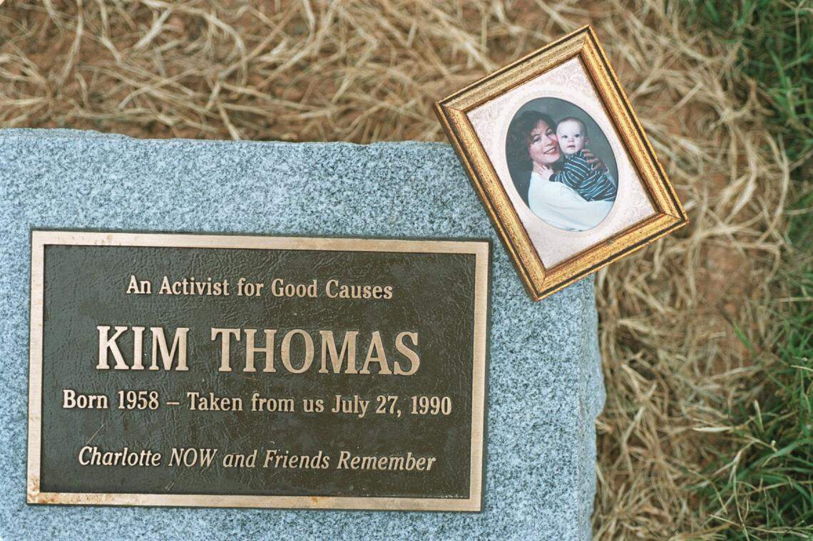 A Kim Thomas memorial at Charlotte’s Freedom Park on Oct. 25, 2000, with a photo of her 1-year-old son Elliott Friedland. Thomas was killed in 1990. 
