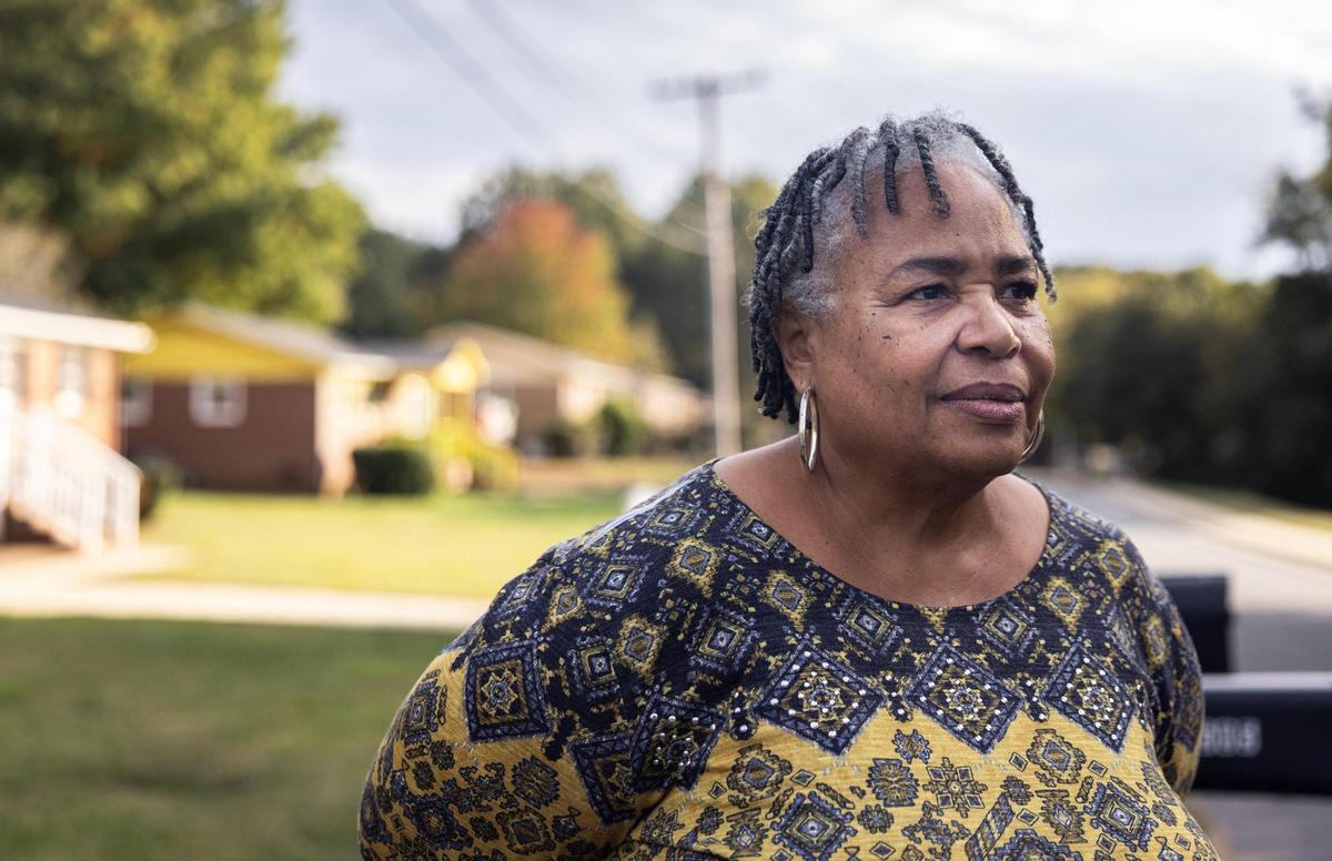 Karen Monteith poses for a portrait in the Smithville neighborhood in Cornelius, N.C., on Tuesday, October 11, 2022.