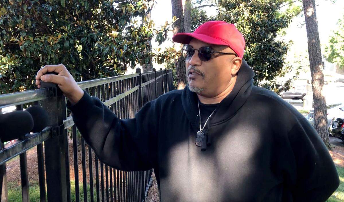 James Daniels talks about the accident on Sharonbrook Drive in Charlotte, NC., on Wednesday, May 11, 2022. A Charlotte-Mecklenburg School bus was involved in a head-on collision with a dump trunk Wednesday morning. Jeff Siner/The Charlotte Observer
