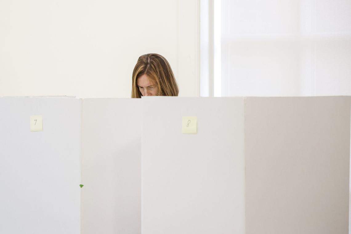 Mary Smith casts her ballot during early voting at South Park Library in Charlotte this 2024 file photo.
