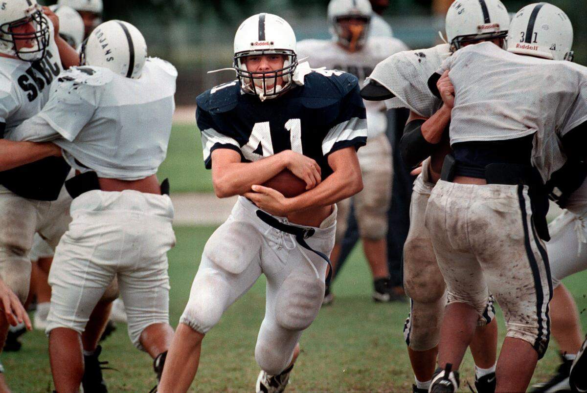 Dan Morgan (41), then a Taravella High School fullback, runs with the ball. Morgan went on to start at Miami, and then for the Carolina Panthers of the NFL.