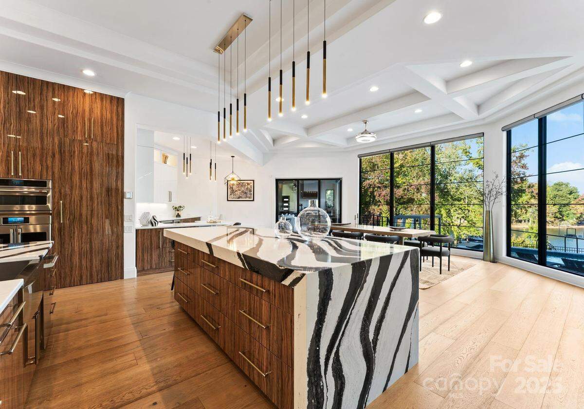 Sunlight enters the home through its many large glass windows.