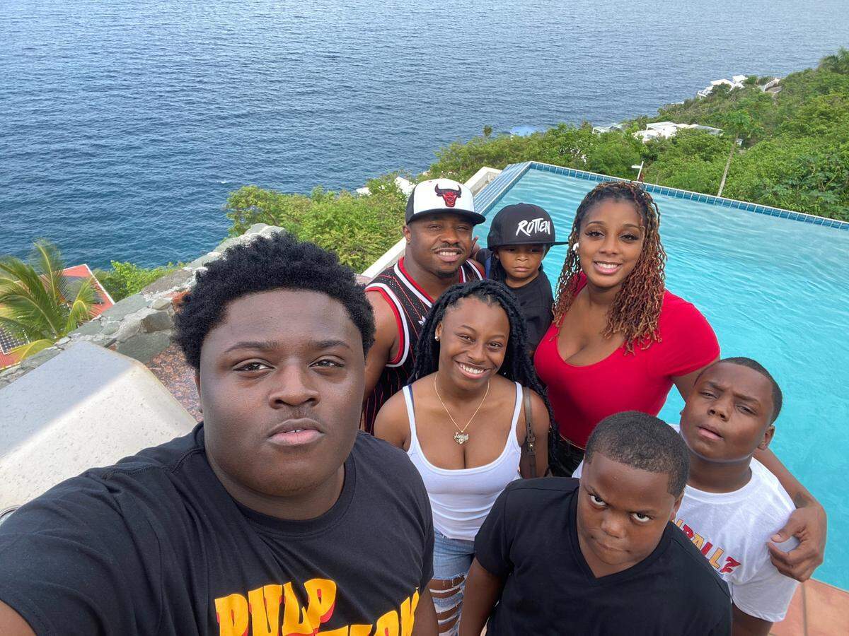 Mallard Creek football player Isaiah Cash with his family on a Carribean vacation. Front row: Isaiah Cash, Da shun Weeks. Middle row: Sariah and Da’Quan Weeks. Back row: Quinton Jones (father), Nasir Jones and Vinetae Wynn (girlfriend)