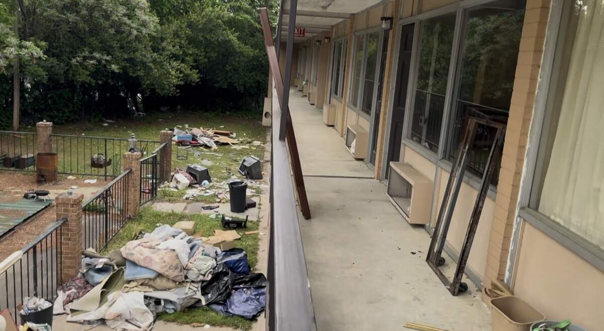 Cedric Dean said he and employees cleared garbage and debris out of many rooms while renovating the Fayetteville property.