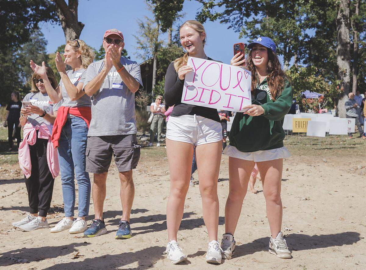 Supporters watch as their loved ones, whether they be cancer survivors or those otherswise impacted by cancer, complete Swim Across America’s annual charity swim near Charlotte, NC, in 2023.