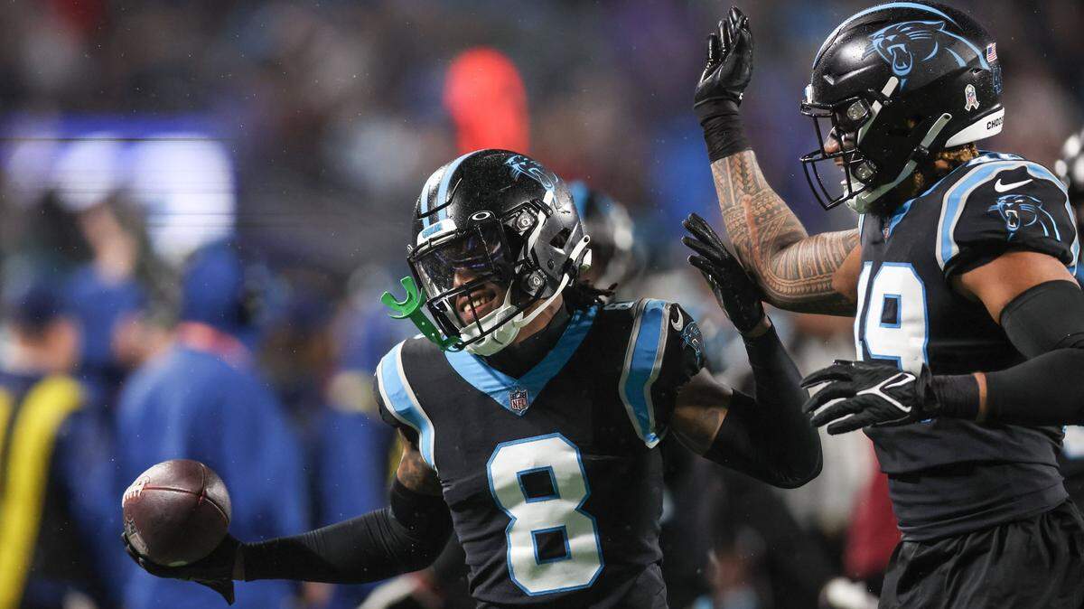 Carolina Panthers cornerback Jaycee Horn celebrates a pick-six in the end zone against the Falcons on Thursday, November 10, 2022.