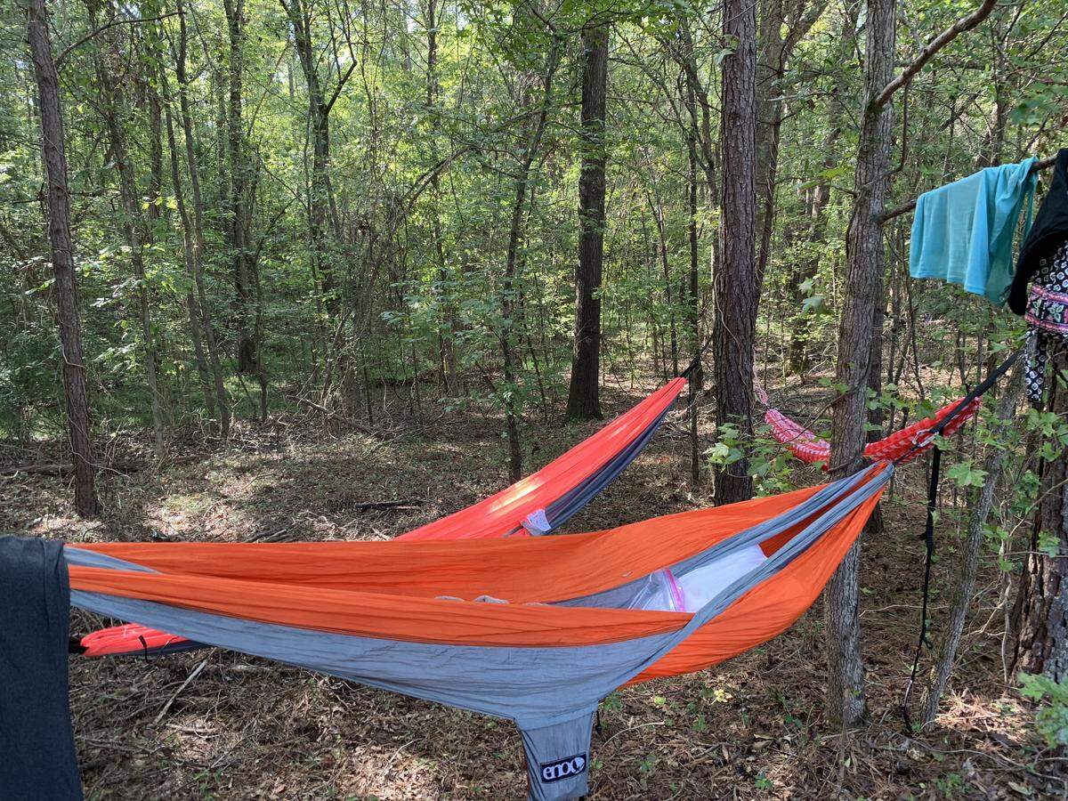 At the Ragnar Trail Carolinas race at the Anne Springs Close Greenway, runners sleep in tents and hammocks between legs.