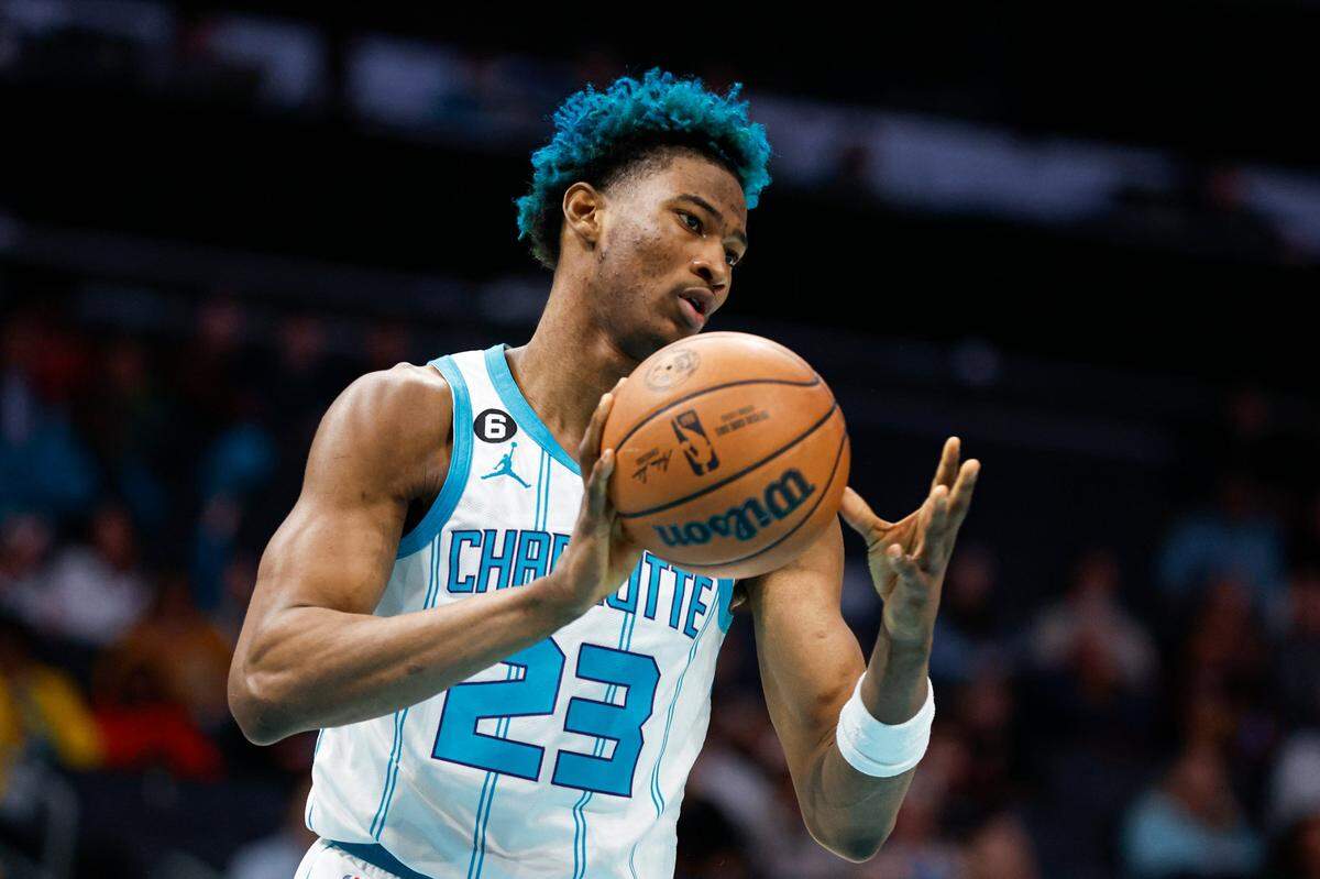 Charlotte Hornets forward Kai Jones passes after pulling in a rebound against the Cleveland Cavaliers during the second half of an NBA basketball game in Charlotte, N.C., Tuesday, March 14, 2023. Cleveland won 120-104. (AP Photo/Nell Redmond)