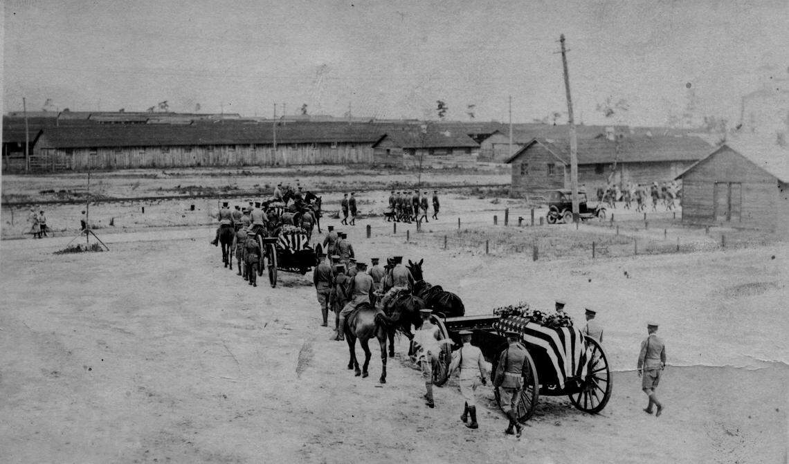 A funeral procession for three fallen soldiers departs from Camp Greene.