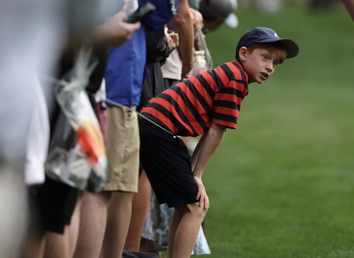 A young child watches the 2026 Truist Championship at the Quail Hollow Club on Thursday, May 7.