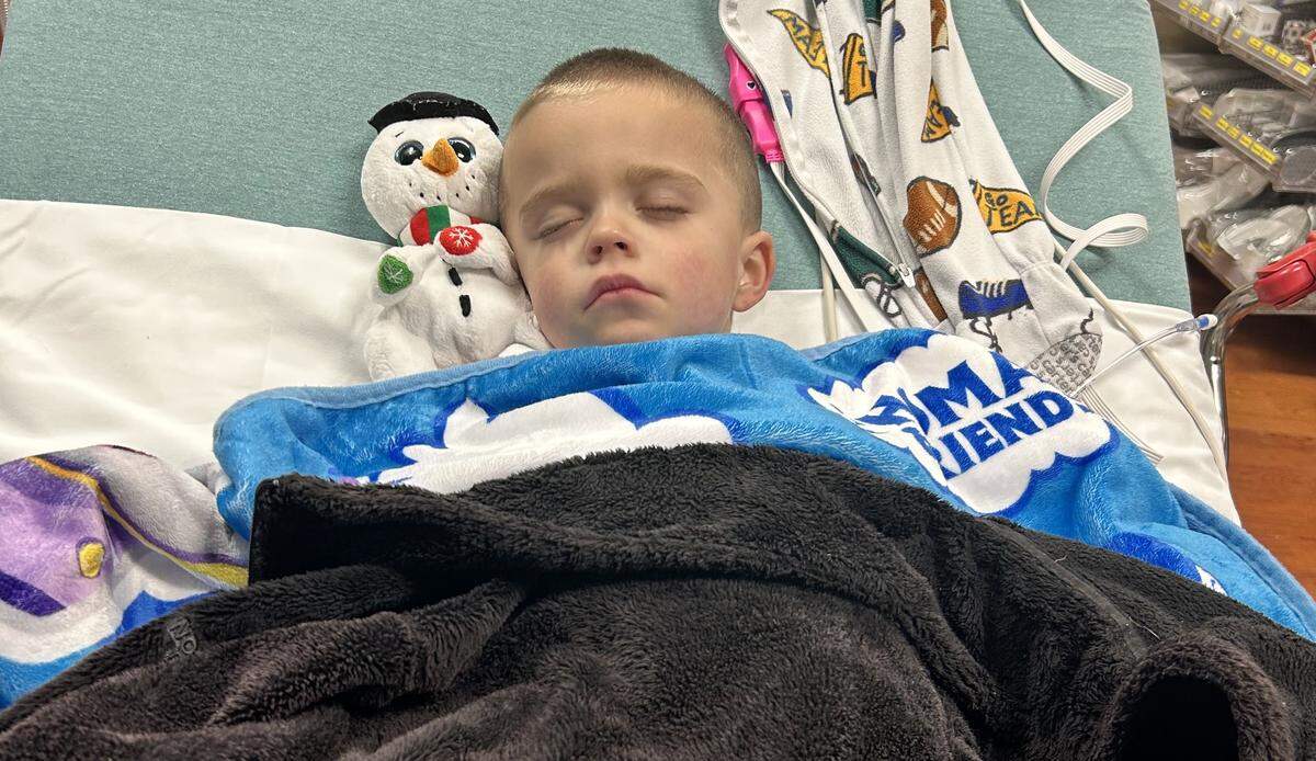 Logan in a bed at the Jeff Gordon Children’s Center before he was airlifted to Charlotte.