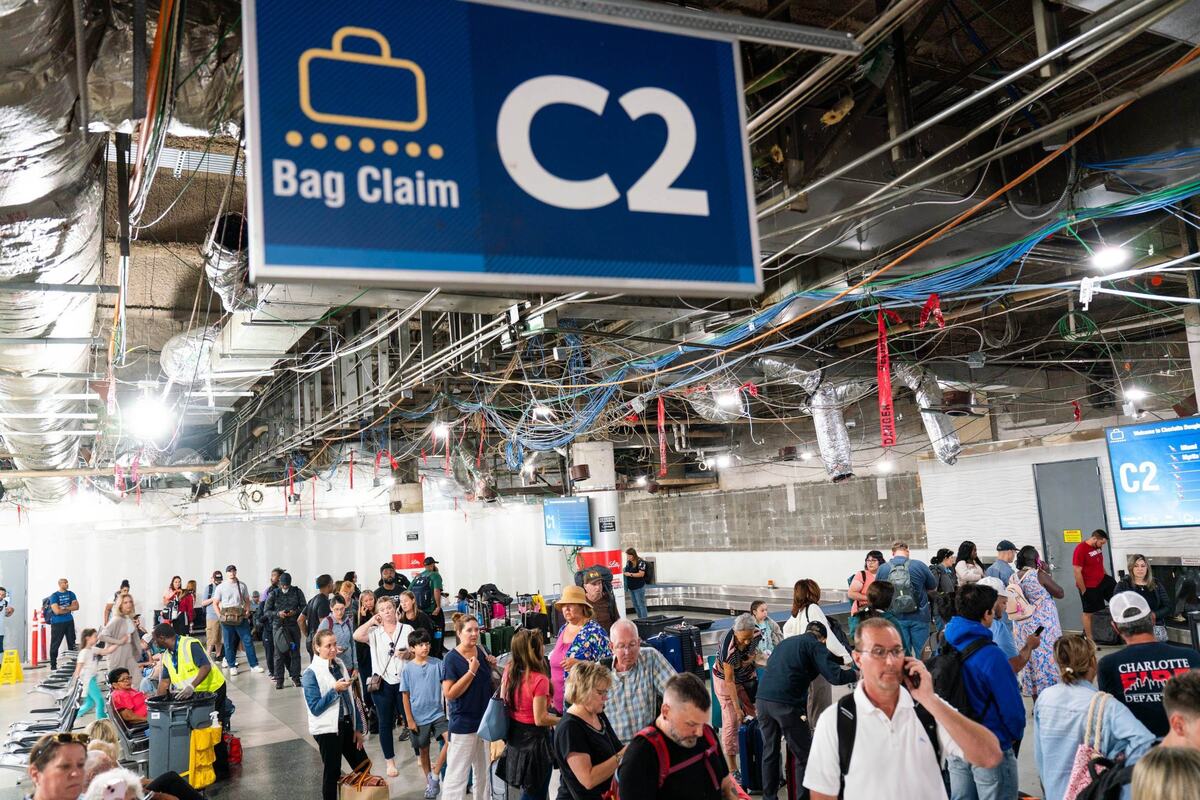 Baggage claim C inside the Charlotte Douglas International Airport on August 5, 2024. Many people were still at the airport Wednesday dealing with delays.