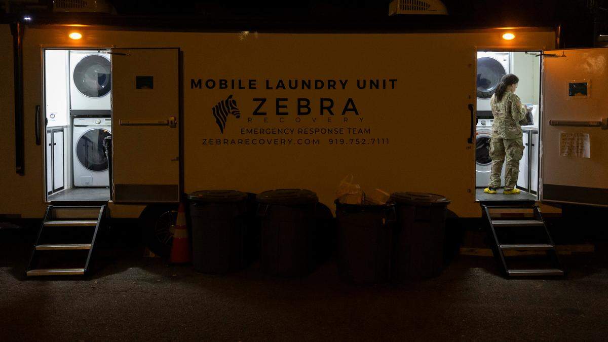 A National Guardsman uses a free laundry unit at the First Baptist Church on Tuesday, October 8, 2024 in Old Fort, N.C.
