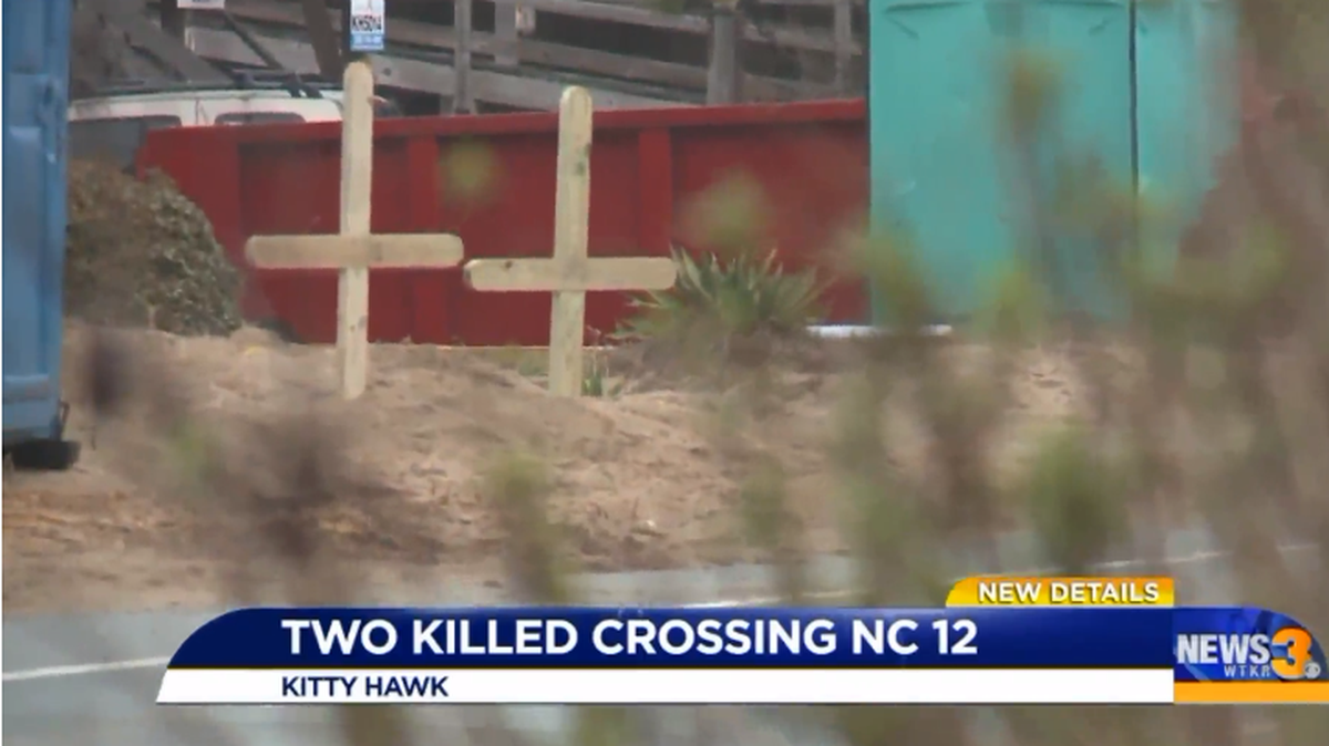 Two crosses were put up at the spot where a Virginia couple was run over and killed this week in Kitty Hawk. Video screenshot/WTKR