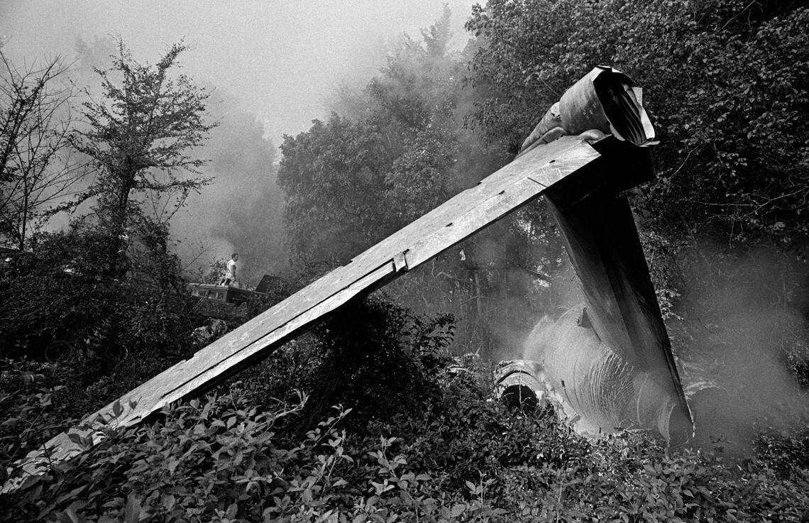 Smoke drifts from the broken tail section of the Eastern Air Lines plane that crashed in Charlotte on Sept. 11, 1974.