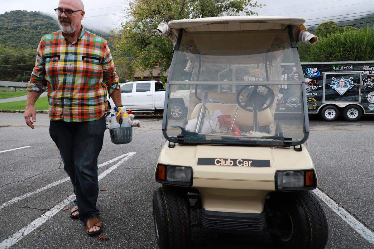 Joseph Franklyn McElroy carries cleaning supplies through the parking lot at the Meadowlark.