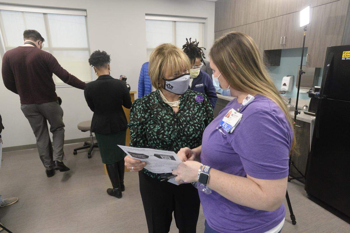 Charlotte Mayor Vi Lyles talks with nurse Ann Morkaut, RN, BSN after getting her COVID-19 shot at Novant Health Michael Jordan Family Medical Clinic on Tuesday, January 26, 2021.