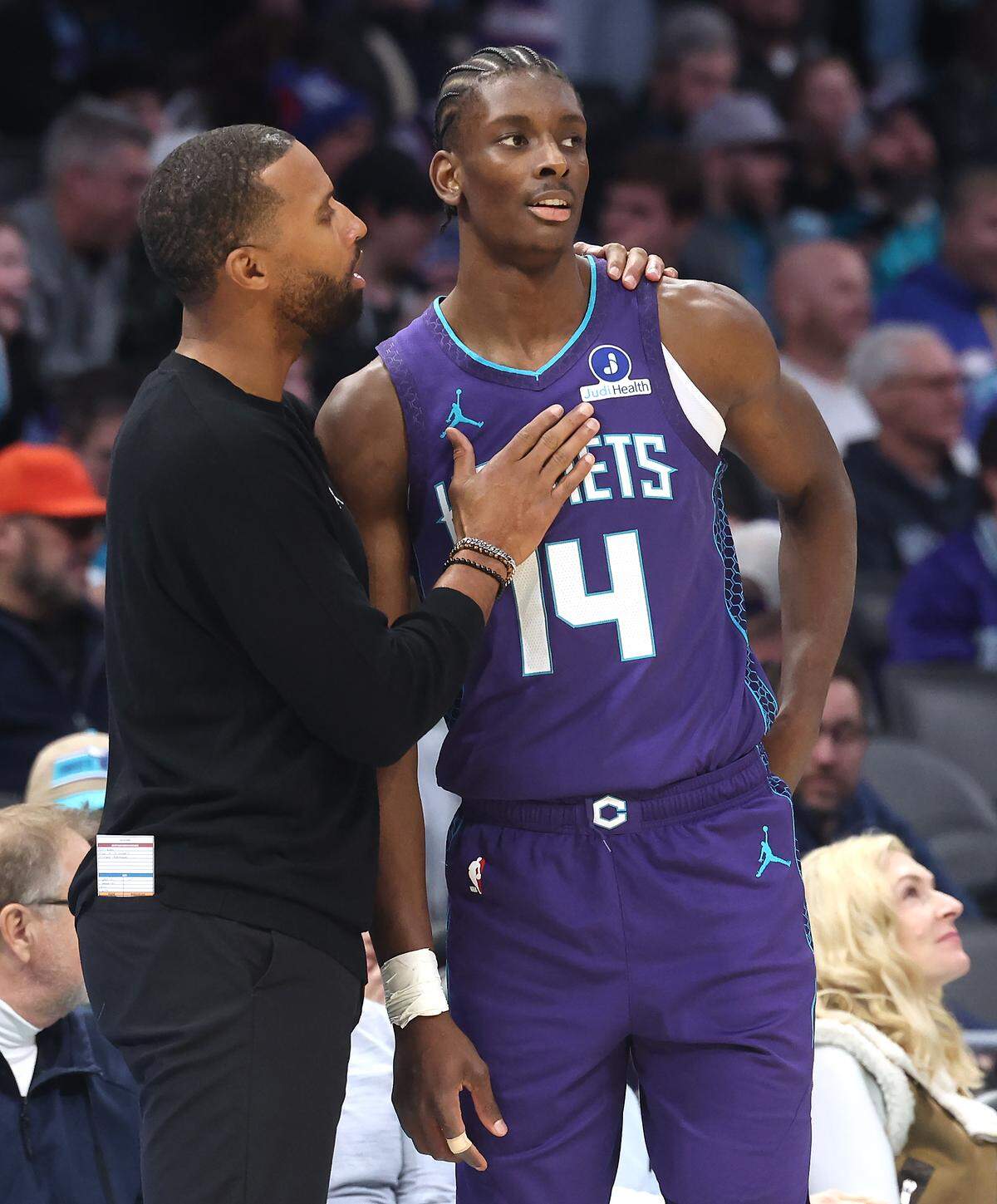 Charlotte Hornets head coach Charles Lee, left, speaks with forward/center Moussa Diabate during action against the Philadelphia 76ers on Jan. 26, 2026, at Spectrum Center in Charlotte.