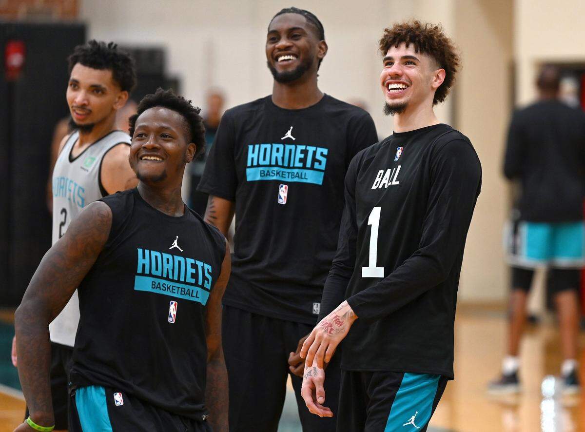 (L-R) Charlotte Hornets guards James Bouknight, Terry Rozier, forward Jalen McDaniels and guard LaMelo Ball laugh as they participate in an after practice shootaround on Tuesday, September 27, 2022.