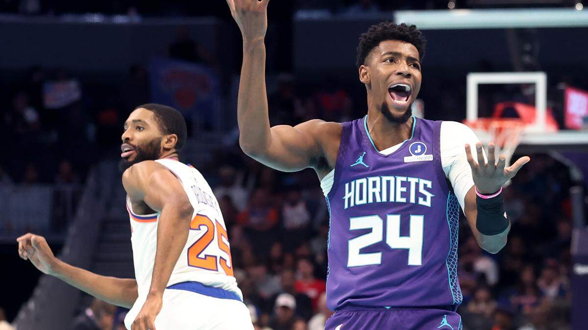 Charlotte Hornets guard Brandon Miller, right, reacts to a no call following a shot attempt during action against the New York Knicks at Spectrum Center in Charlotte, NC on Wednesday, November 26, 2025.
