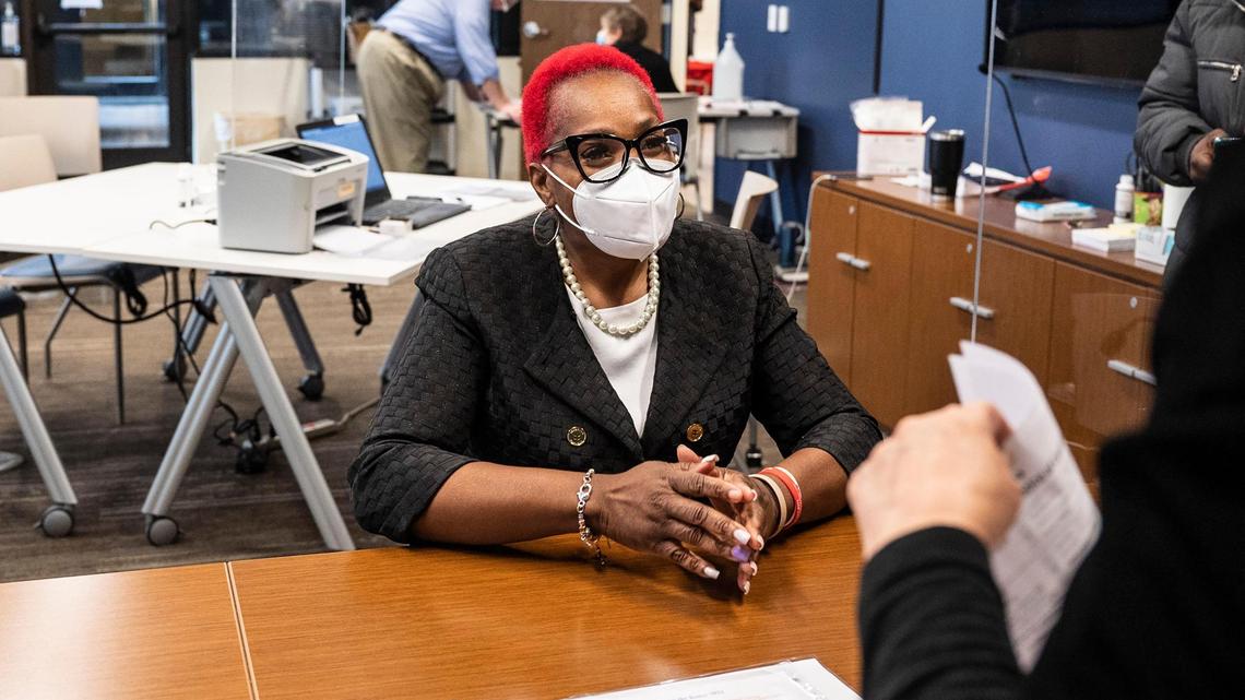 Lucille Puckett, left, completes candidate paperwork to run for Charlotte mayor at the Mecklenburg County Board of Elections on Feb. 24, 2022. This is Puckett’s fourth time as a mayoral candidate. She previously ran in 2013, 2017, 2019 and is making another attempt for 2022.