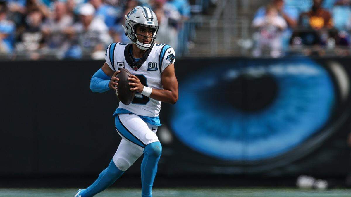 Panthers quarterback Bryce Young runs with the ball while looking to pass during the game against the Los Angeles Chargers at Bank of America Stadium in Charlotte, NC on Sunday, September 15, 2024. The Panthers lost, 26-3.