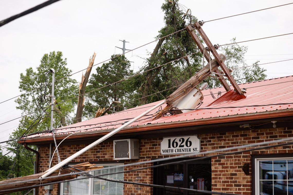 Severe storms caused a utility pole to fall on the roof of Allen’s Mobile Home and RV Superstore on North Chester Street in Gastonia, N.C., on Thursday, May 9, 2024. Storms tore through Gastonia yesterday causing property damage and causing power outages.