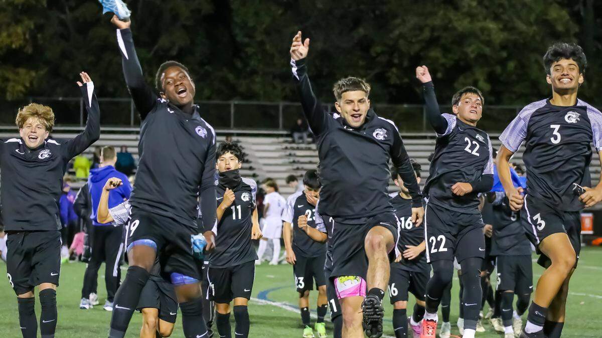 Garinger High School’s boys’ soccer team celebrates its NCHSAA playoff win Tuesday night against visiting Mooresville.