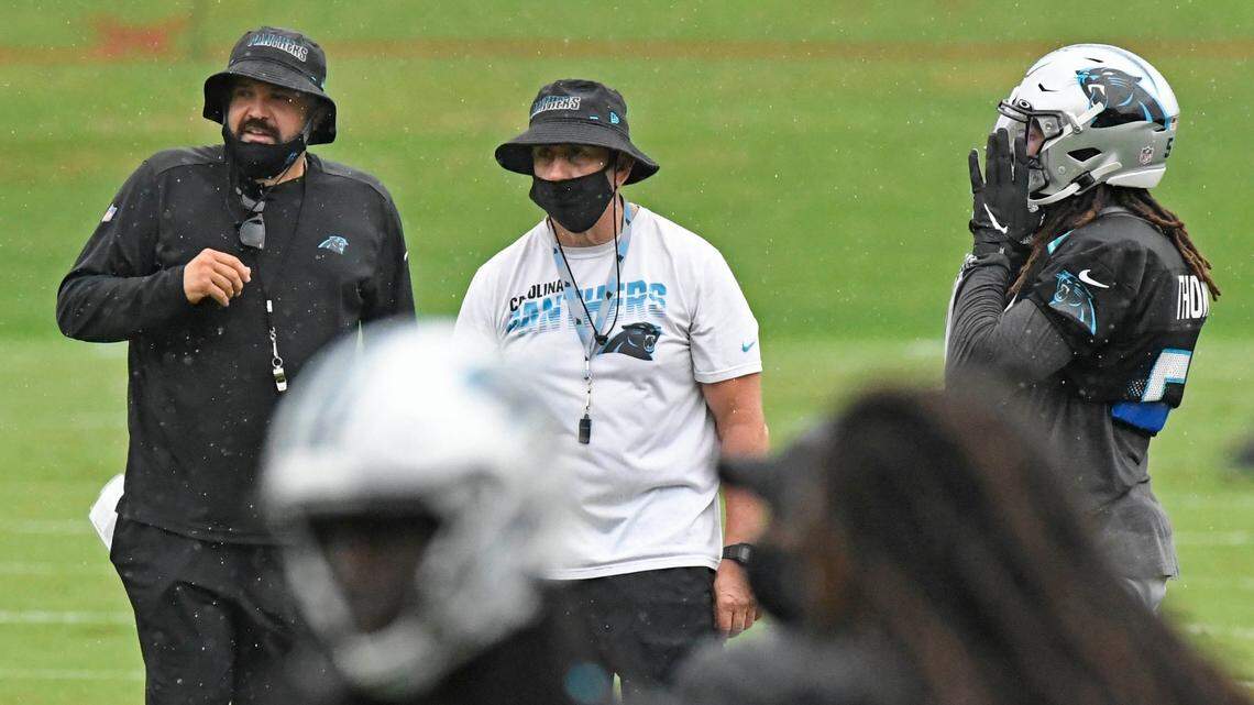 Carolina Panthers defensive coordinator Phil Snow, center, likes what Steve Wilks (not pictured) is bringing to the team.