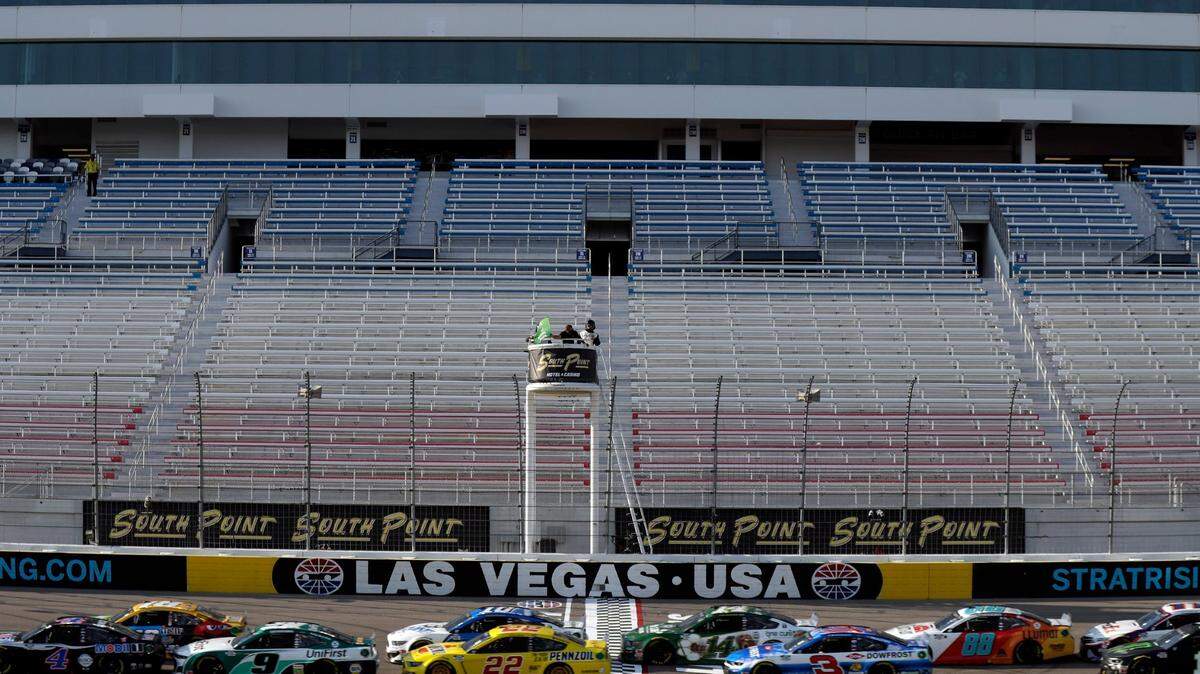 Drivers pass the start finish line during a NASCAR Cup Series auto race Sunday, Sept. 27, 2020, in Las Vegas. The race was run without fans due to COVID-19. (AP Photo/Isaac Brekken)