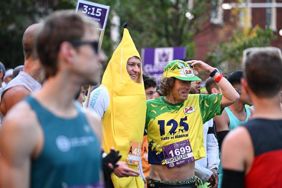 Participants smile before taking part in the 20th annual Novant Health Charlotte Marathon on Saturday, Nov. 16, 2024, in Charlotte