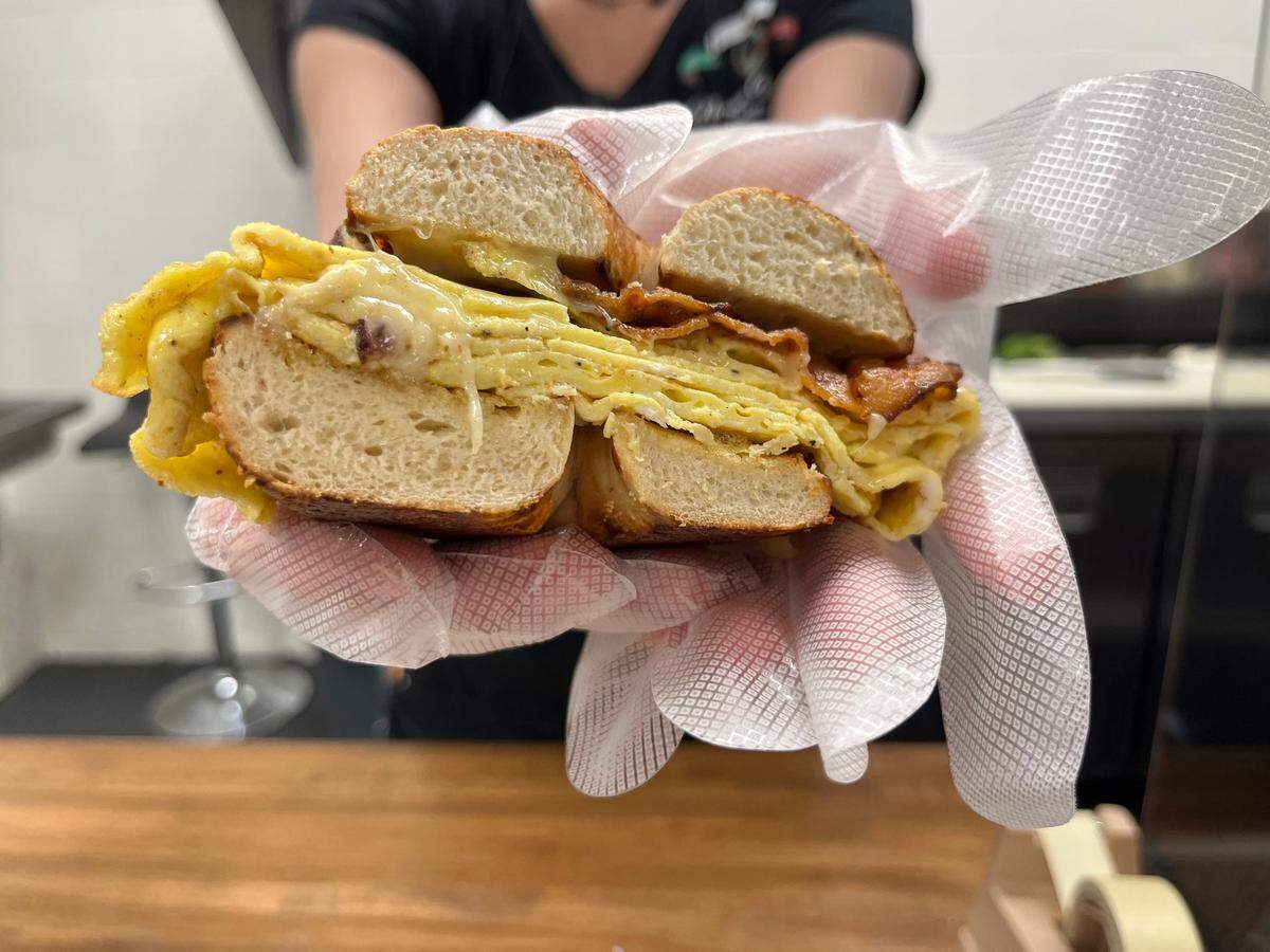 Breakfast sandwiches such as this bacon, egg and cheese on an Asiago bagel, are made fresh to order at Nonna Maria’s Italian Deli & Market.