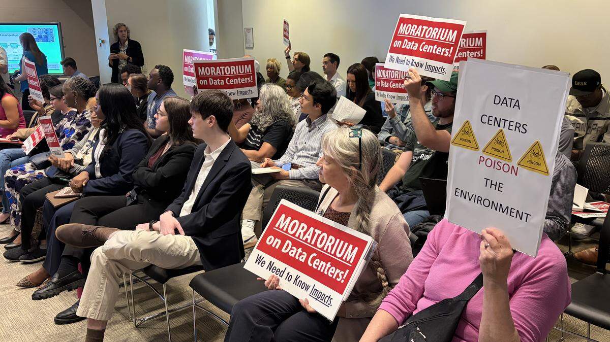 Several people packed the Charlotte City Council chamber room in support of a moratorium on data center rezonings and construction. Council discussed moving the proposed moratorium to a public hearing.