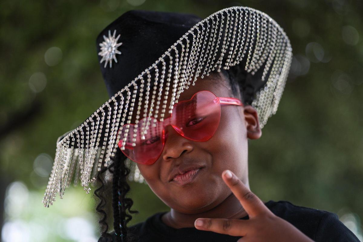 Crissey Pope, 9, strikes a pose before seeing Beyonce tonight at Bank of America Stadium on Wednesday, August 9, 2023 in Charlotte, NC. Pope, who turns 10 this month, was given tickets to the concert as an early birthday present.
