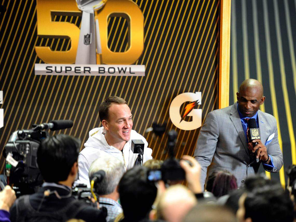 Denver quarterback Peyton Manning enjoys a moment with the media during “Super Bowl Opening Night” in San Jose, Calif., in February 2016.