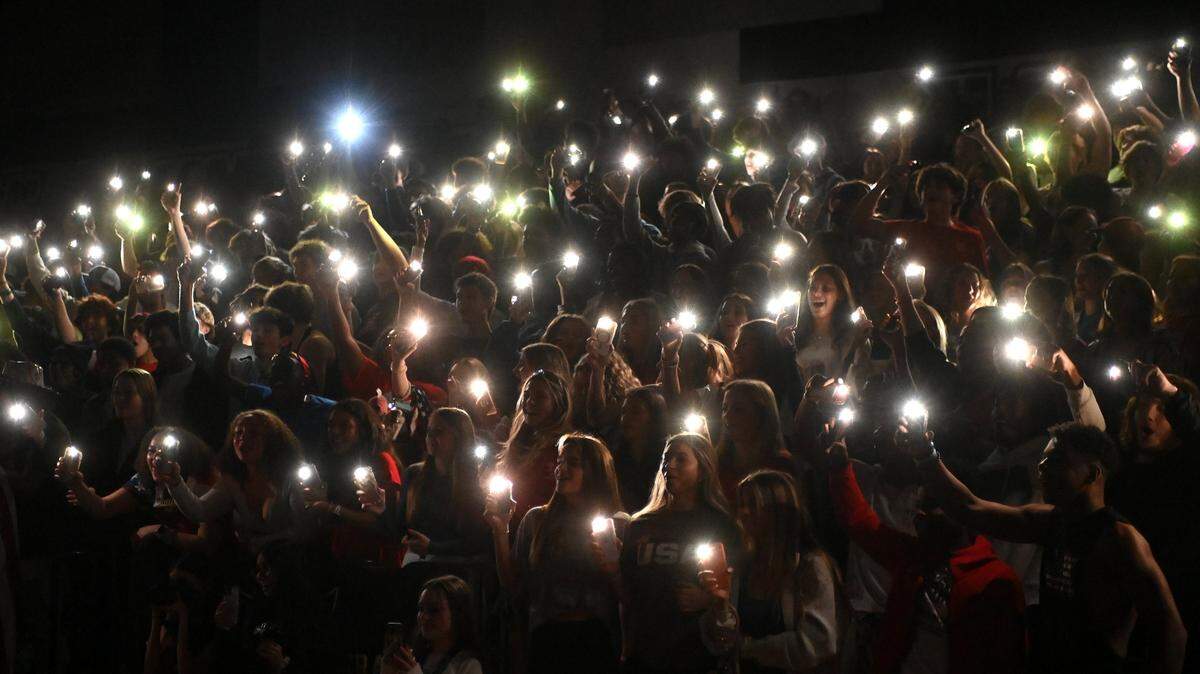 Ardrey Kell Knights light up the stands during the team’s introduction prior to action against the Myers Park Mustangs on Friday, January 27, 2023.
