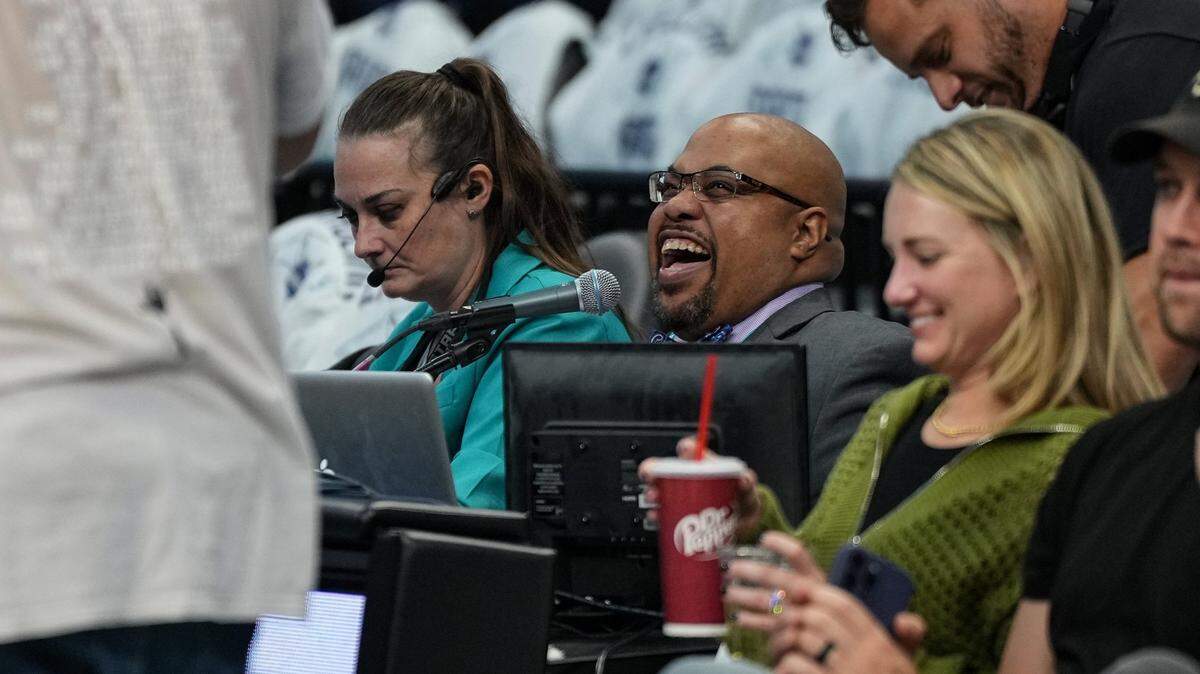 Charlotte Hornets public address announcer Shawn Parker smiles prior to an NBA basketball game between the Miami Heat and Charlotte Hornets, Saturday, Oct. 26, 2024, in Charlotte, N.C. (Charlotte Observer /Matt Kelley)