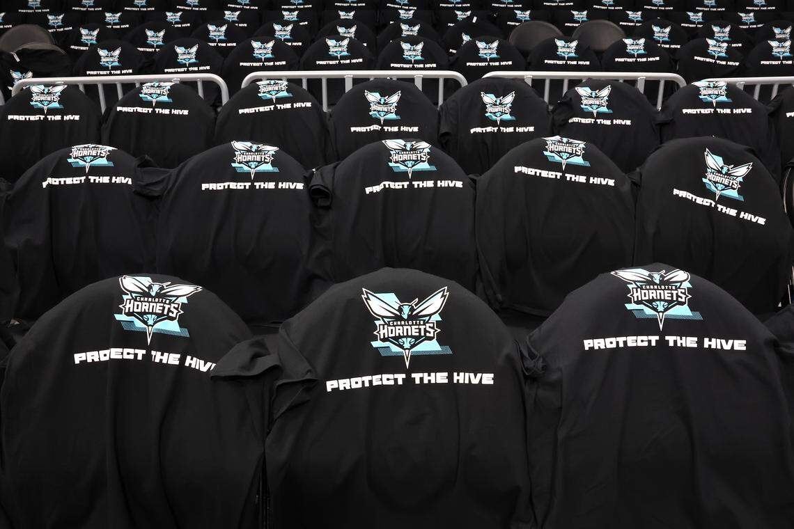 Protect the Hive T-shirts cover the eats at Spectrum Center before Tuesday night’s Hornets-Heat play-in tournament game. 