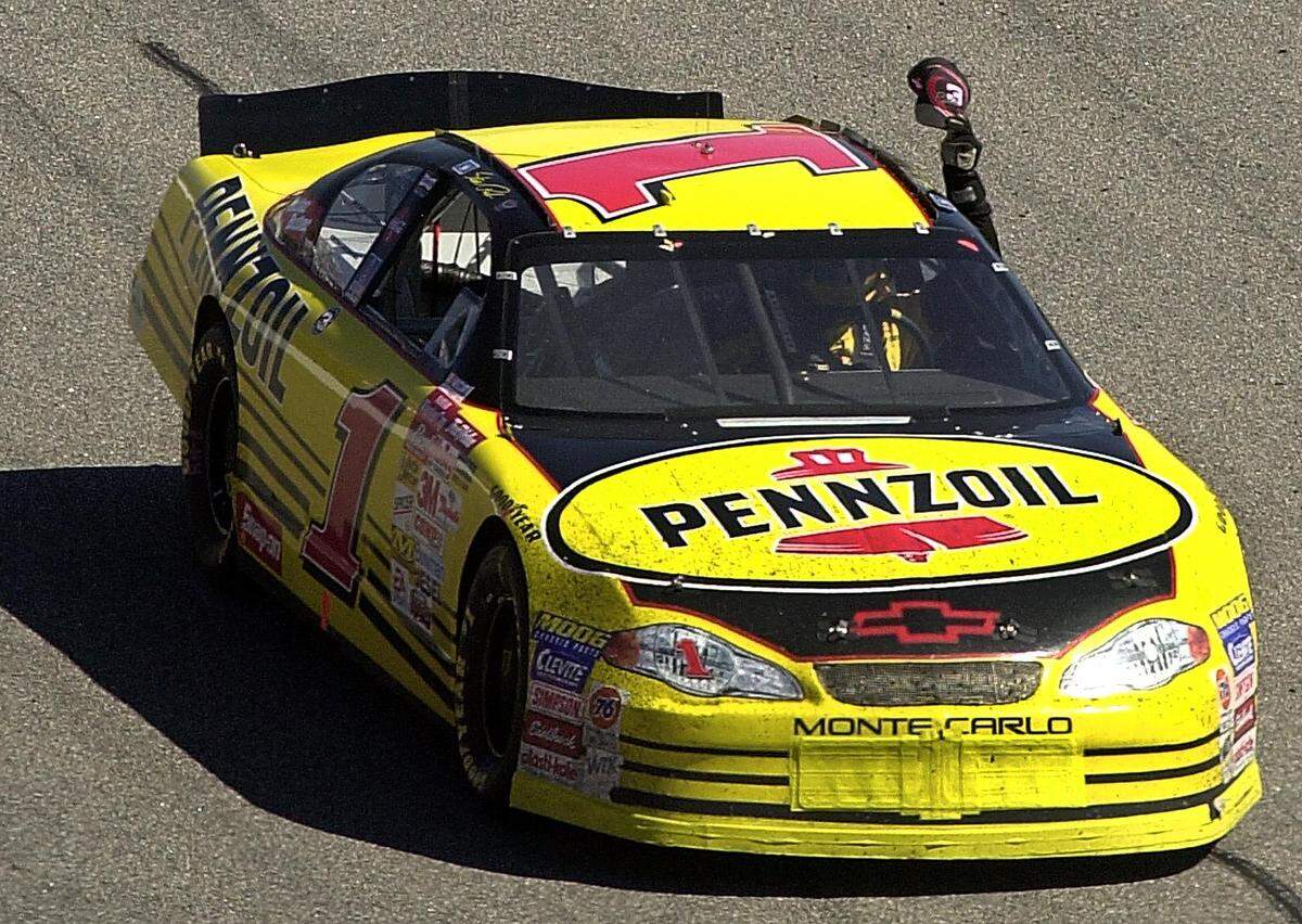 02/25/01: NASCAR driver Steve Park proudly displays a Dale Earnhardt #3 hat during his victory lap, after winning the Dura-Lube 400, Monday afternoon February 26, 2001, at the North Carolina Motor Speedway, in Rockingham, NC. PATRICK SCHNEIDER/STAFF