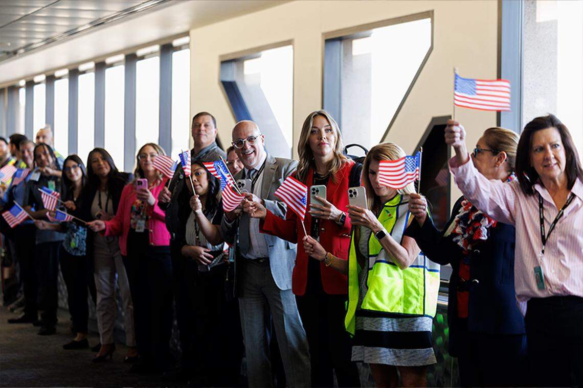 Team members and volunteers line up for the sendoff at PHX.
