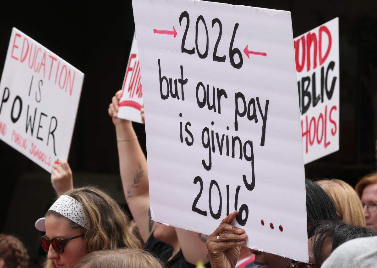 Signs, signs, signs were everywhere as teachers rallied at the Government Complex in Raleigh.