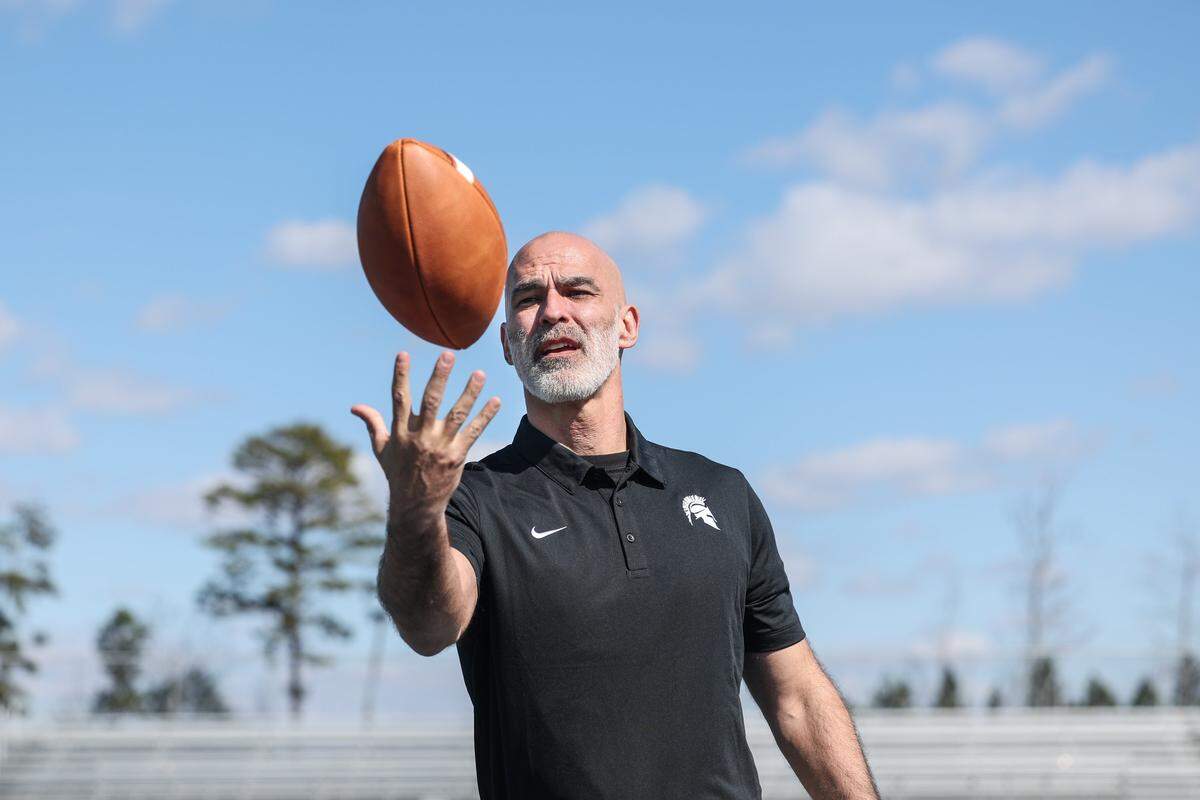 Kenneth McClamrock is the new football coach at Community School of Davdison in Huntersville, NC. McClamrock posed for a portrait on the school’s football field on Monday, February 23, 2026.