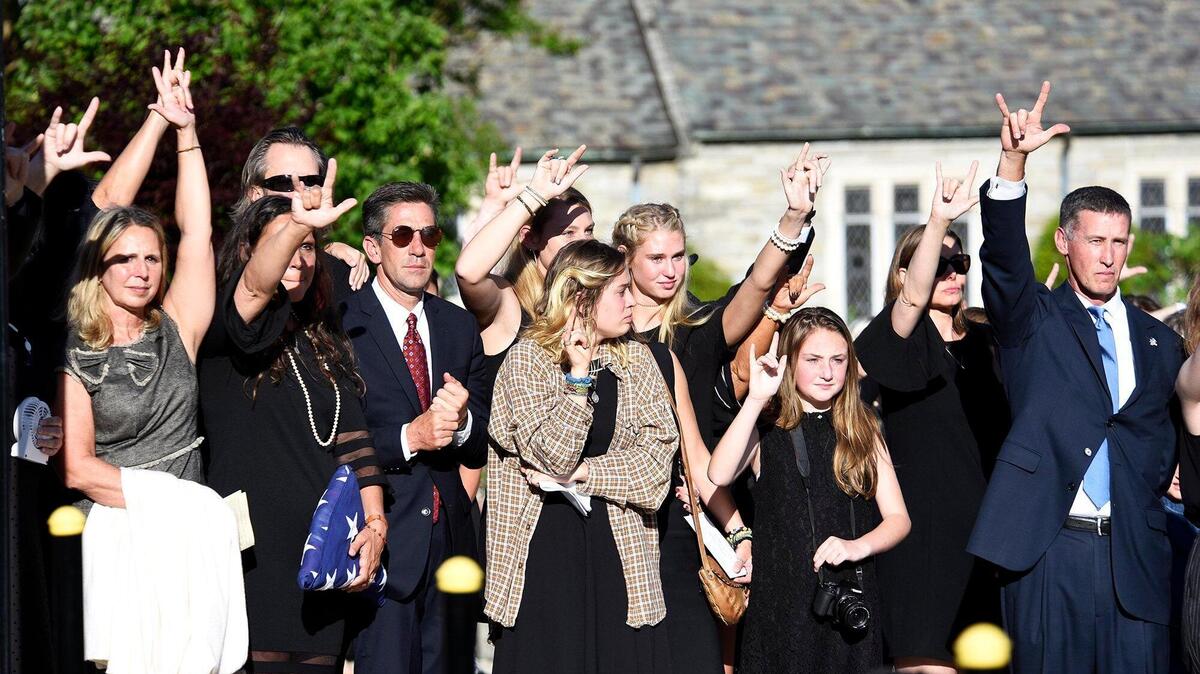 Family and friends of Riley Howell sign “I love you” as his casket is loaded into the hearse Sunday.
At least 1,000 mourners attended a memorial service for Riley Howell who was killed trying to disarm Trystan Andrew Terrell as he fired a hand gun in a UNC Charlotte classroom. Howell, a cadet in UNC Charlotte’s ROTC program, was given full military honors at his funeral. He is seen as a hero who saved the lives of other students after he tackled Terrell on Tuesday. The service was held at Stuart Auditorium at Lake Junaluska near Waynesville, N.C. on Sunday, May 5, 2019.