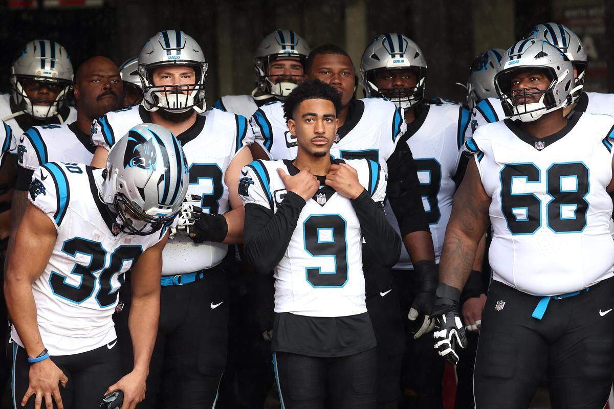 Carolina Panthers quarterback Bryce Young, center, stands in the tunnel with his teammates prior to action against the Tampa Bay Buccaneers at Raymond James Stadium in Tampa, FL. on Saturday, January 3, 2026. The Buccaneers defeated the Panthers 16-14.