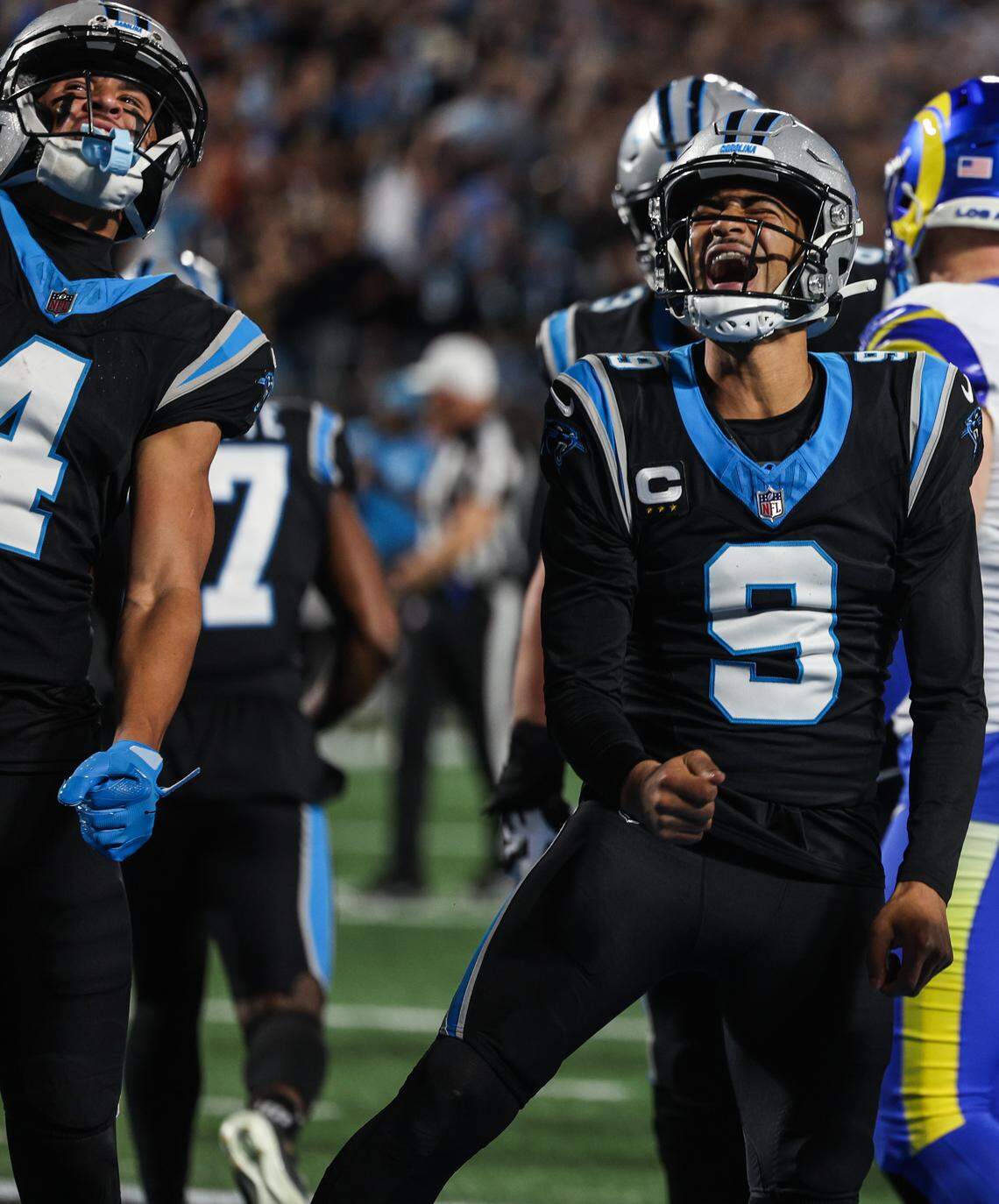 Panthers quarterback Bryce Young celebrates scoring a rushing touchdown during the team’s wild-card playoff game against the Los Angeles Rams in January at Bank of America Stadium.