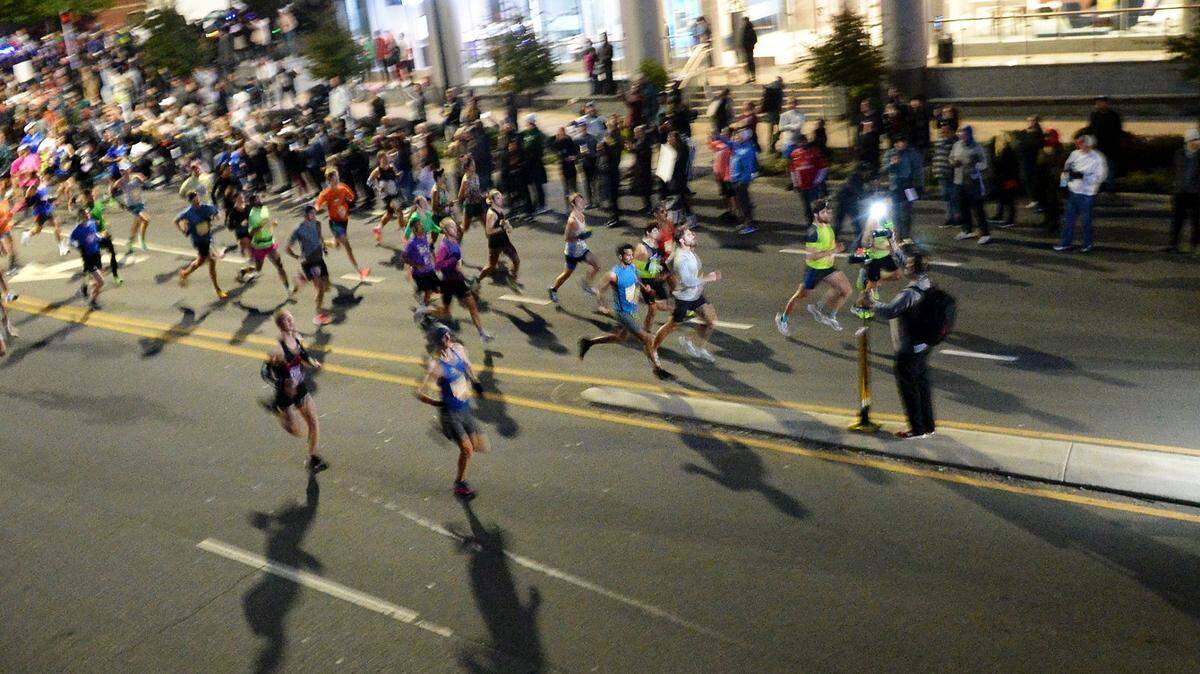 Runners race to the lead at the start of the Novant Health Charlotte Marathon Saturday morning, Nov. 4, 2023
